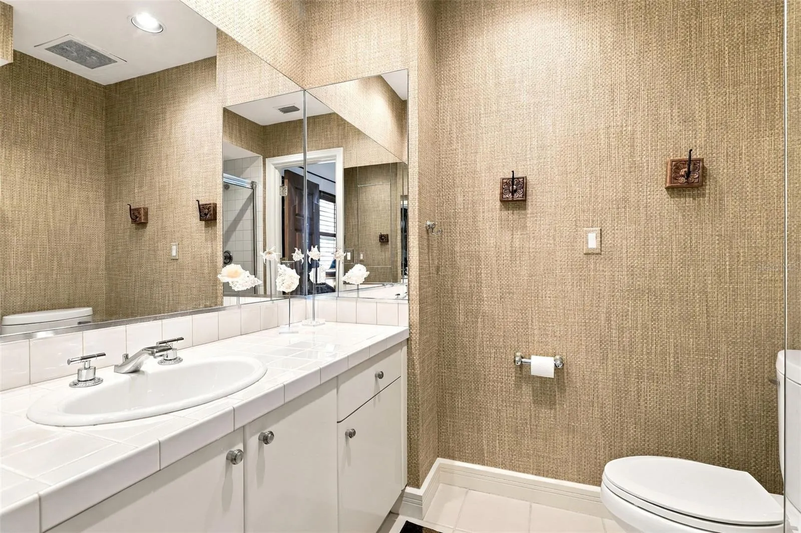 Bathroom 2 offers a stand-alone shower and single vanity.