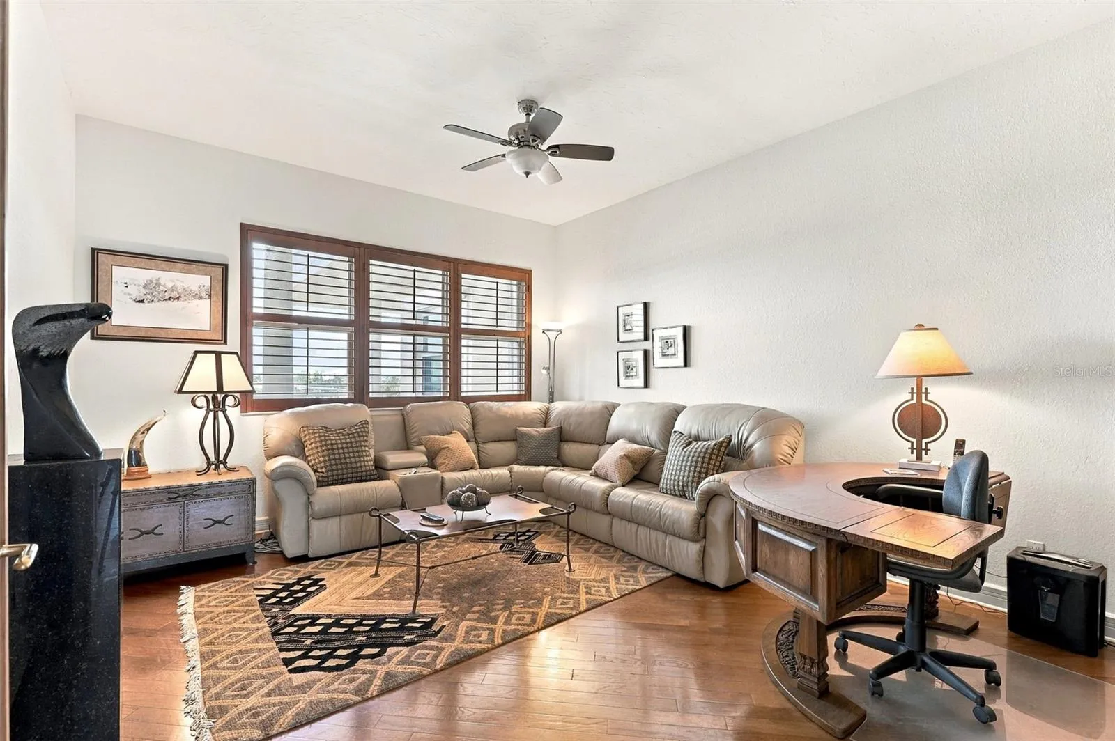 Currently being used as a den, bedroom 3 offers rich engineered hardwood floors.