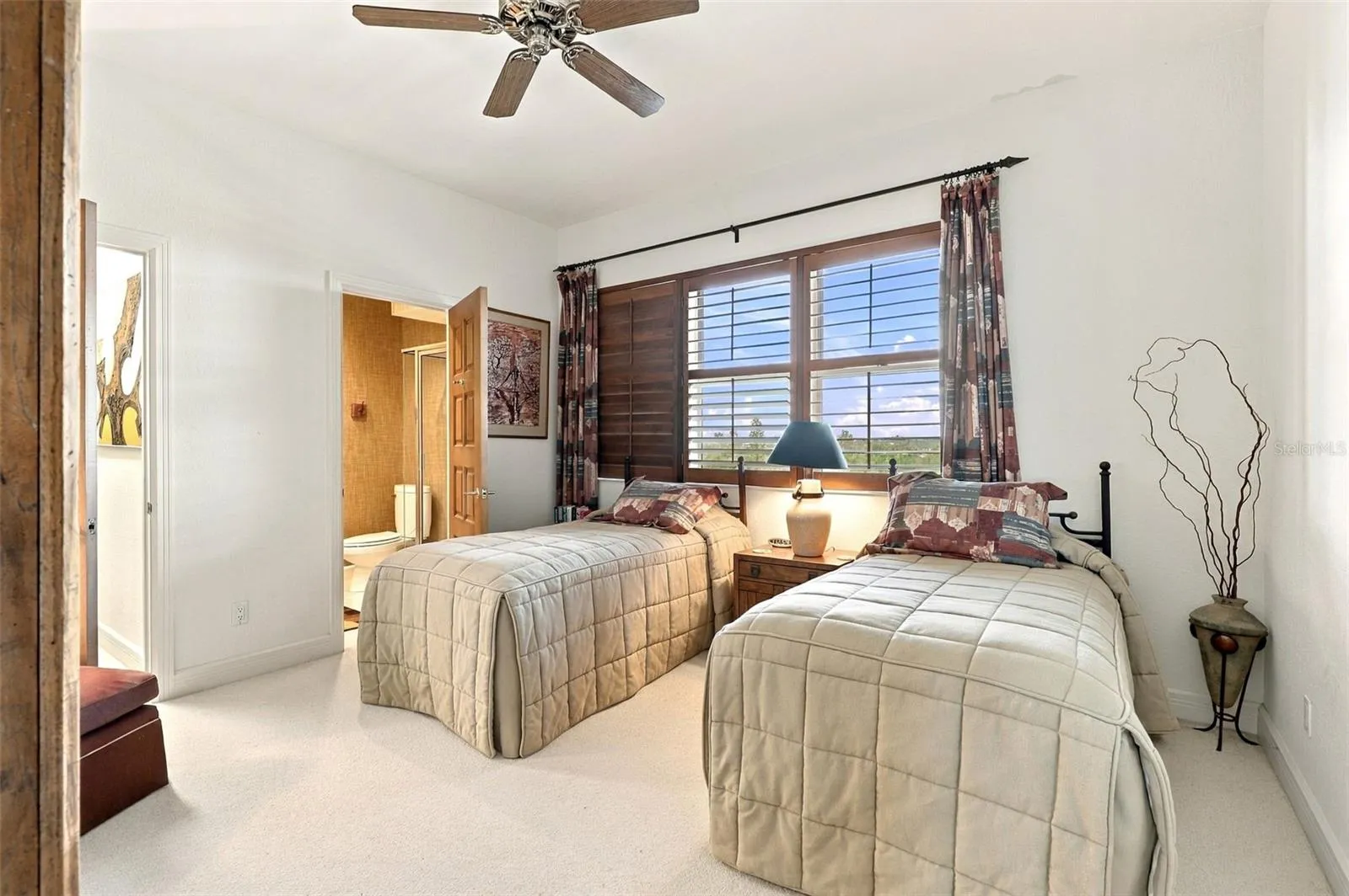 Bedroom 2 offers a walk-in closet and ensuite bath.