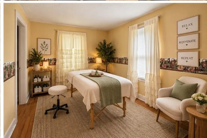 Upstairs bed 4 (virtually staged as a massage session)
