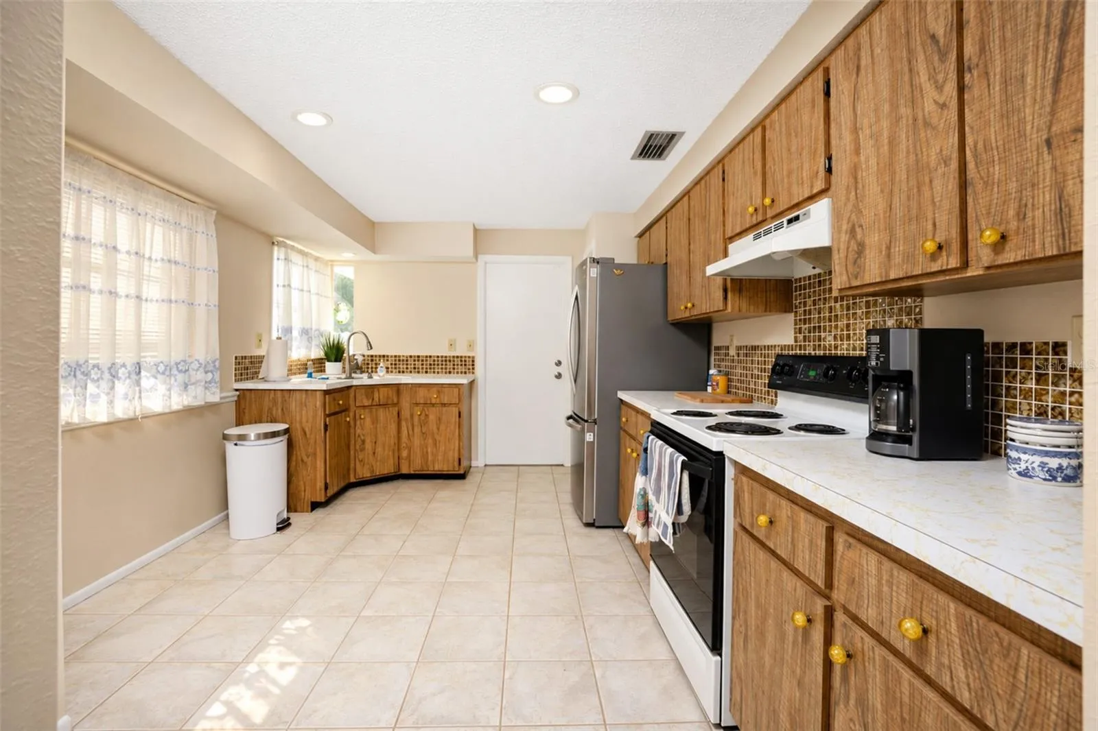 Spacious kitchen accessed through dining room