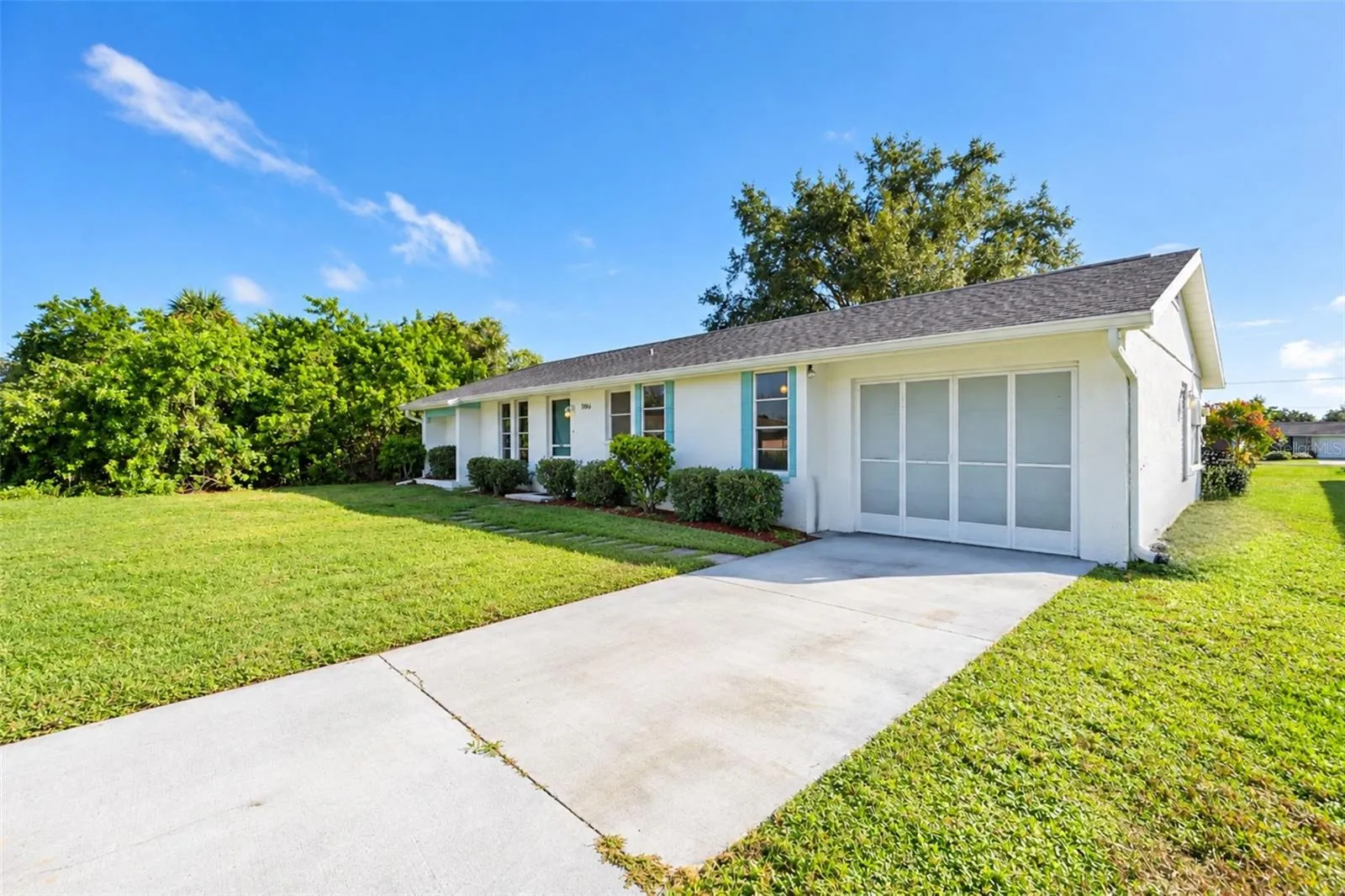 Front view with screened garage