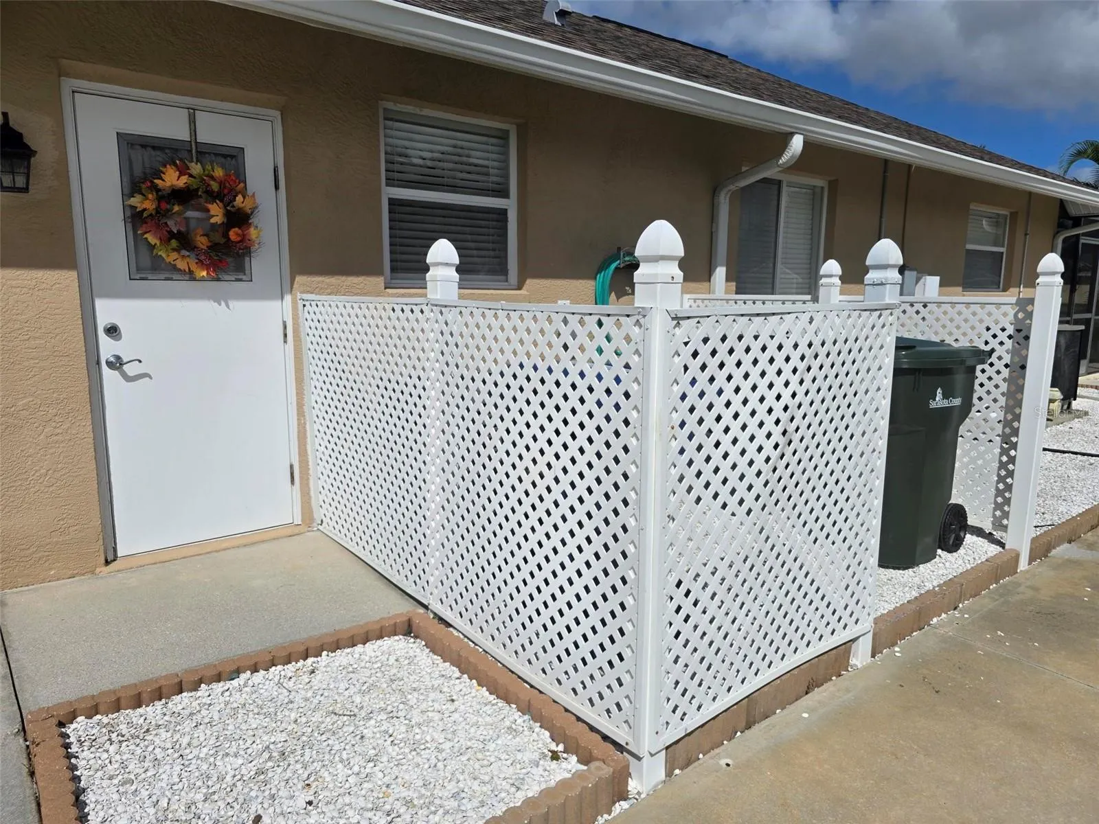 Dedicated area for cans, and side garage entry.