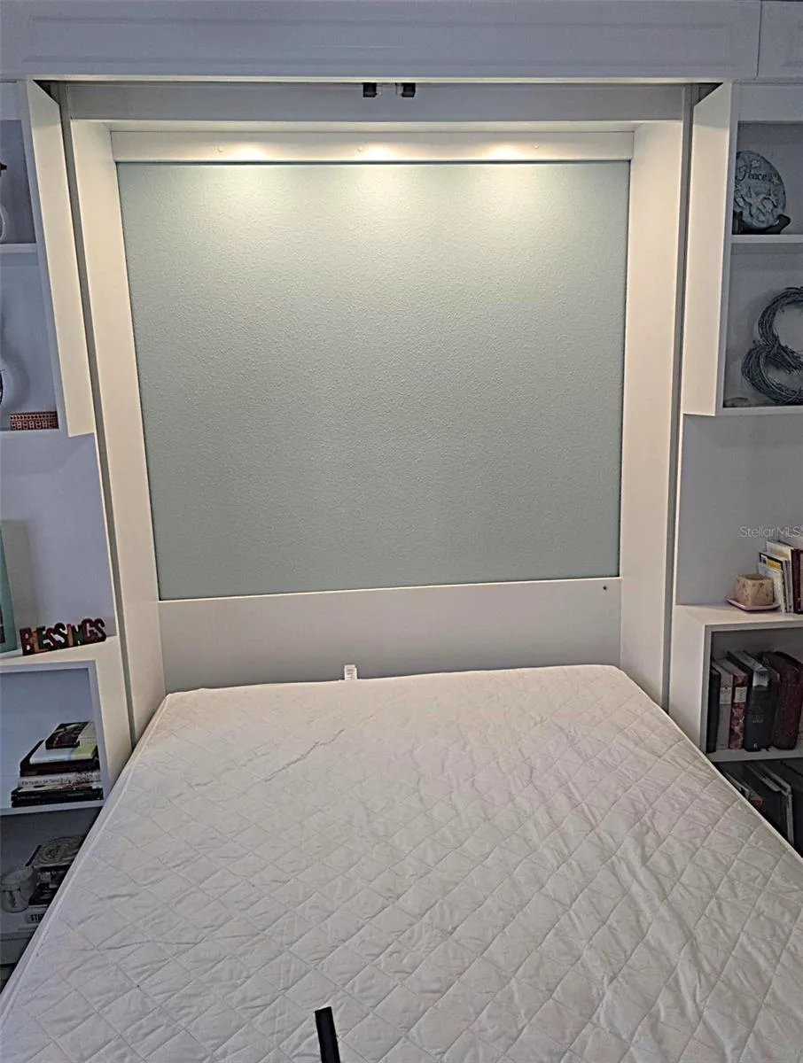 Lighted area behind and above bedding.