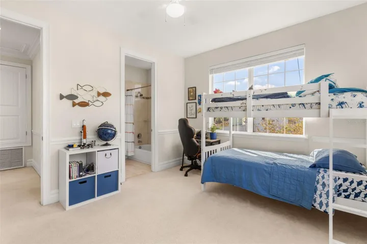 Bedroom 2 features an en suite bath also accessible from main hallway.
