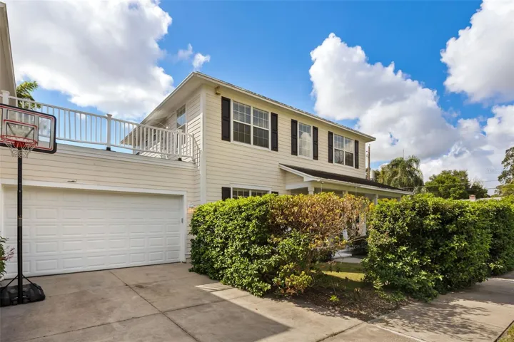 2 car side garage with extended parking accommodates off street parking for 4 vehicles.