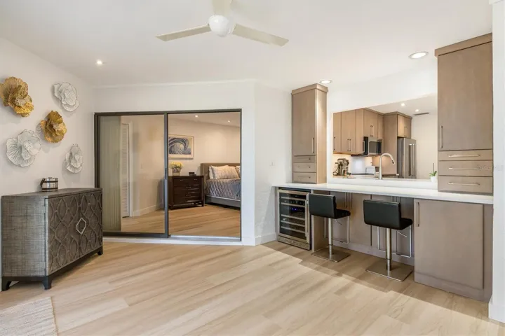 This area is designed for entertainment bar or office/computer area. Storage drawers on right have hidden electronic plugs and printer cabinet. On left end of bar is wine cooler and glassware cabinet.