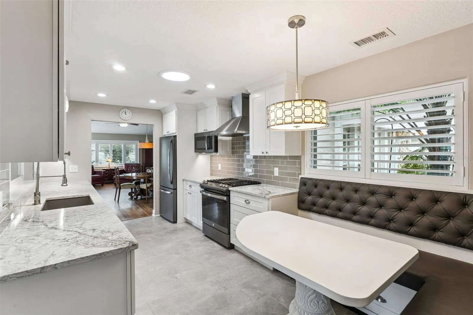 Additional features include a gas range and plantation shutters.