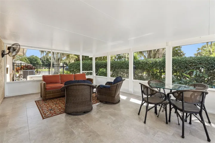 Covered, screened-in lanai off kitchen area.