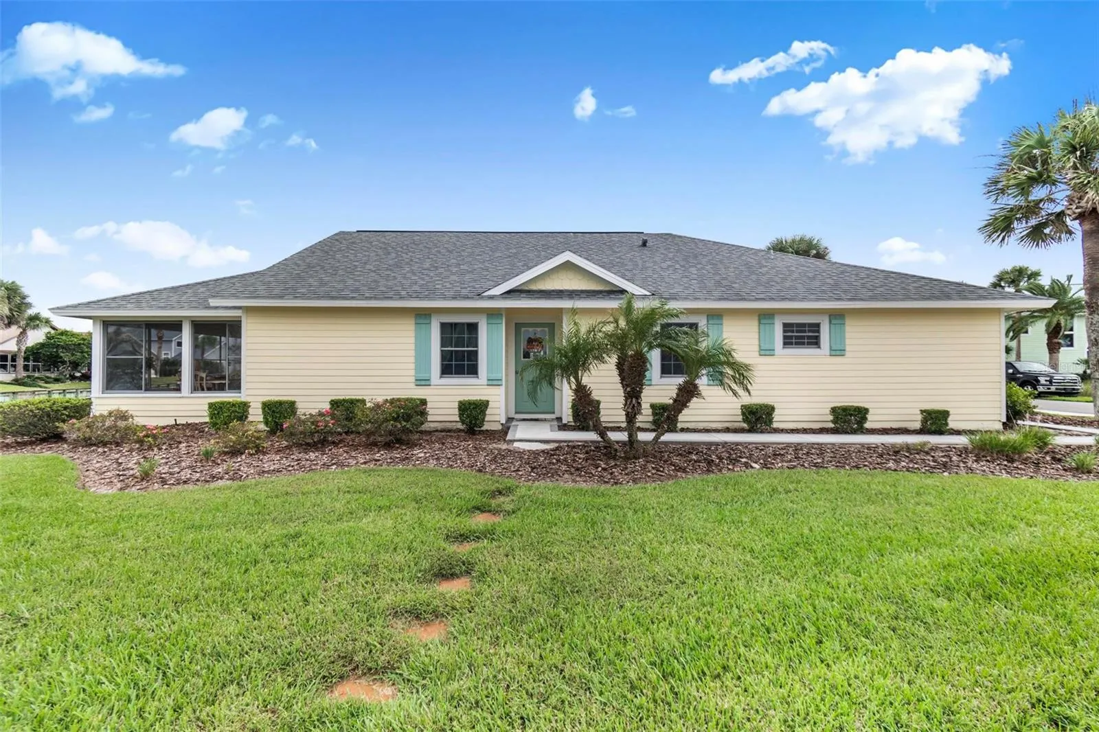 Front of house facing lake and fountain