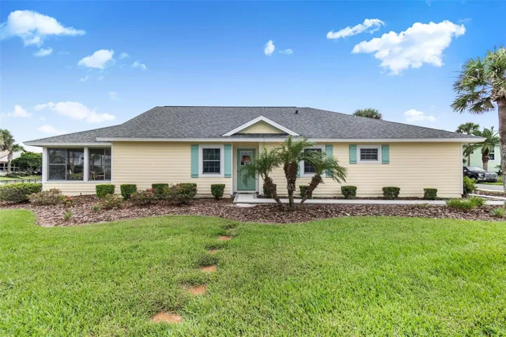 Front of house facing lake and fountain