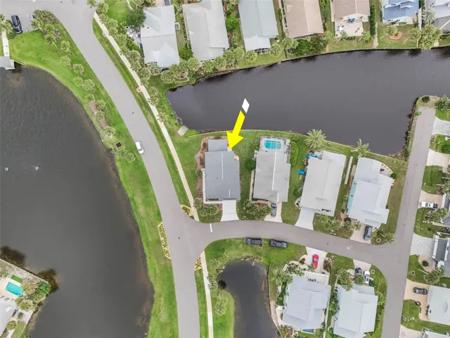 View of lake across the street and canal in front canal in back steps to ocean