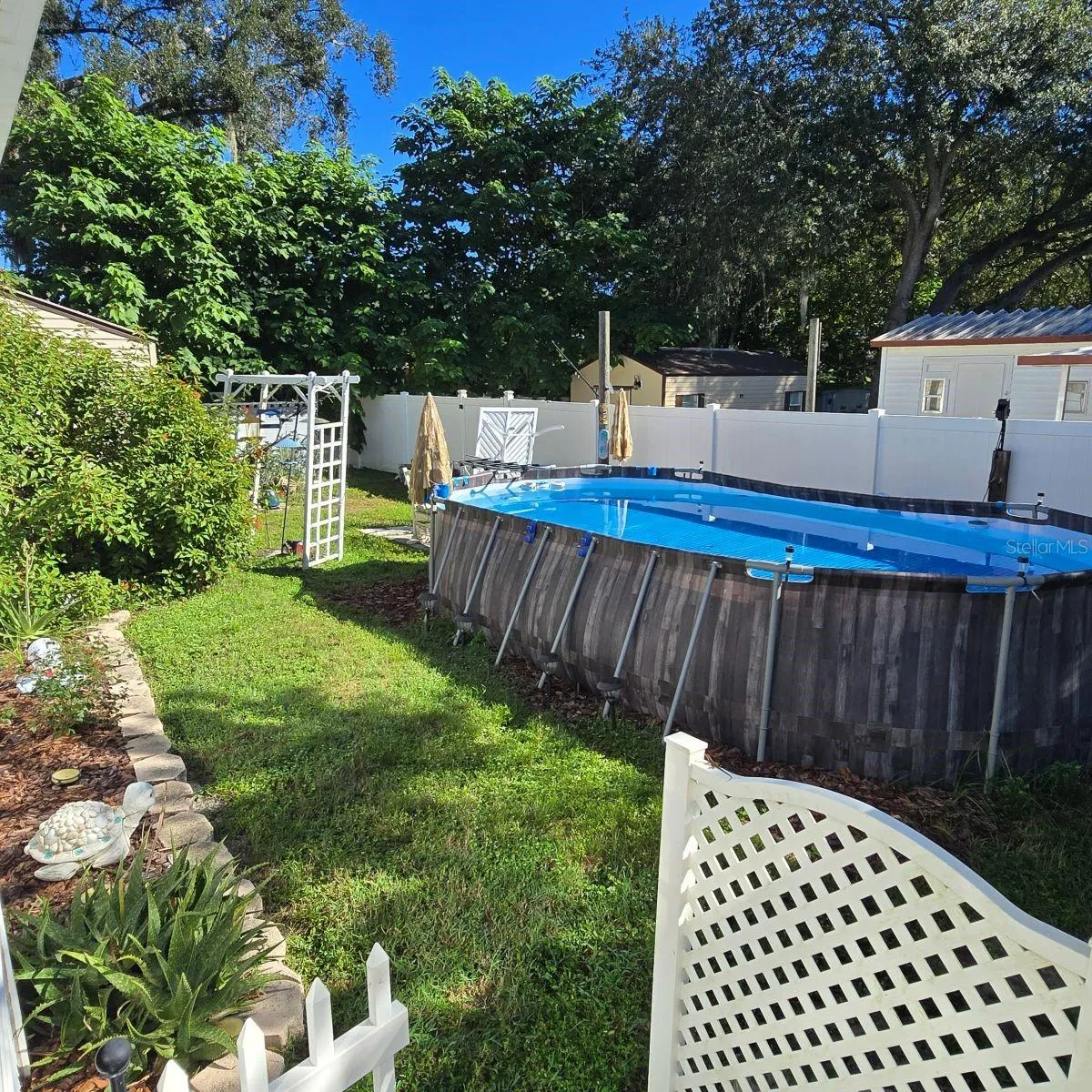 right side of property with above ground pool