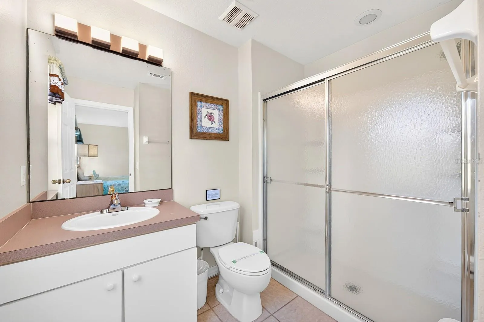 The Primary en suite Bath. All three Bathrooms feature UPDATED FIXTURES INSTALLED IN 2024.