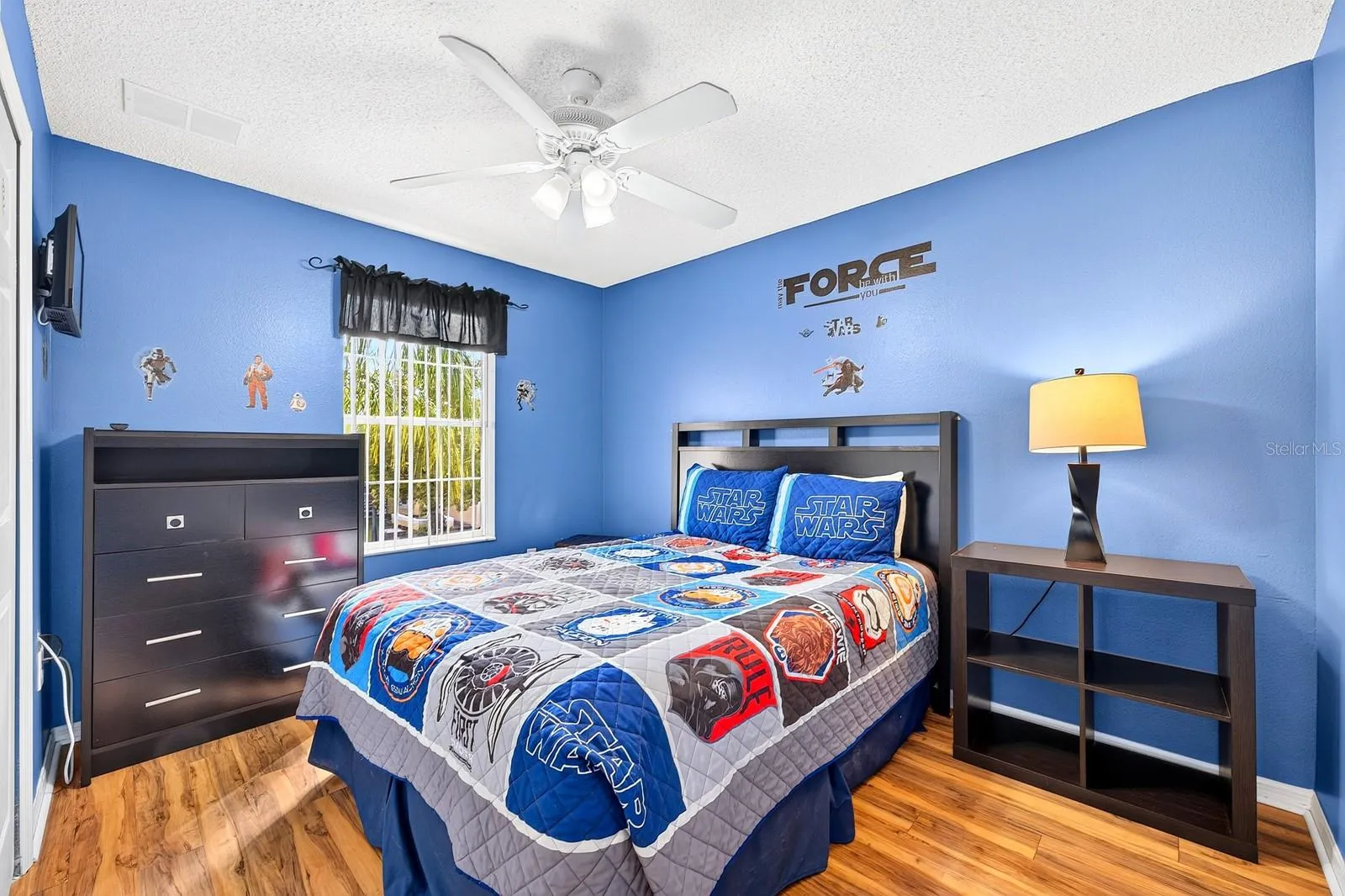 Bedroom 4 is enhanced with wood-look laminate flooring.