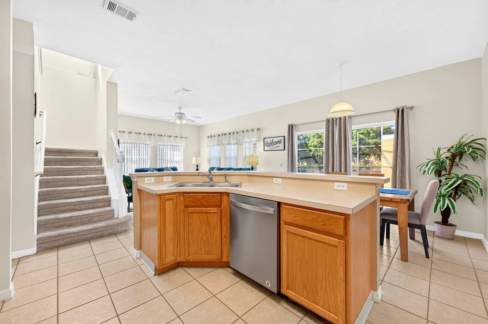 A center island and BREAKFAST BAR provide extra room for meal preparation, casual dining and conversation.