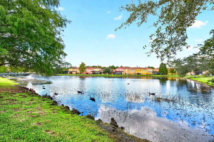 A PEACEFUL POND VIEW adds to the home's appeal.