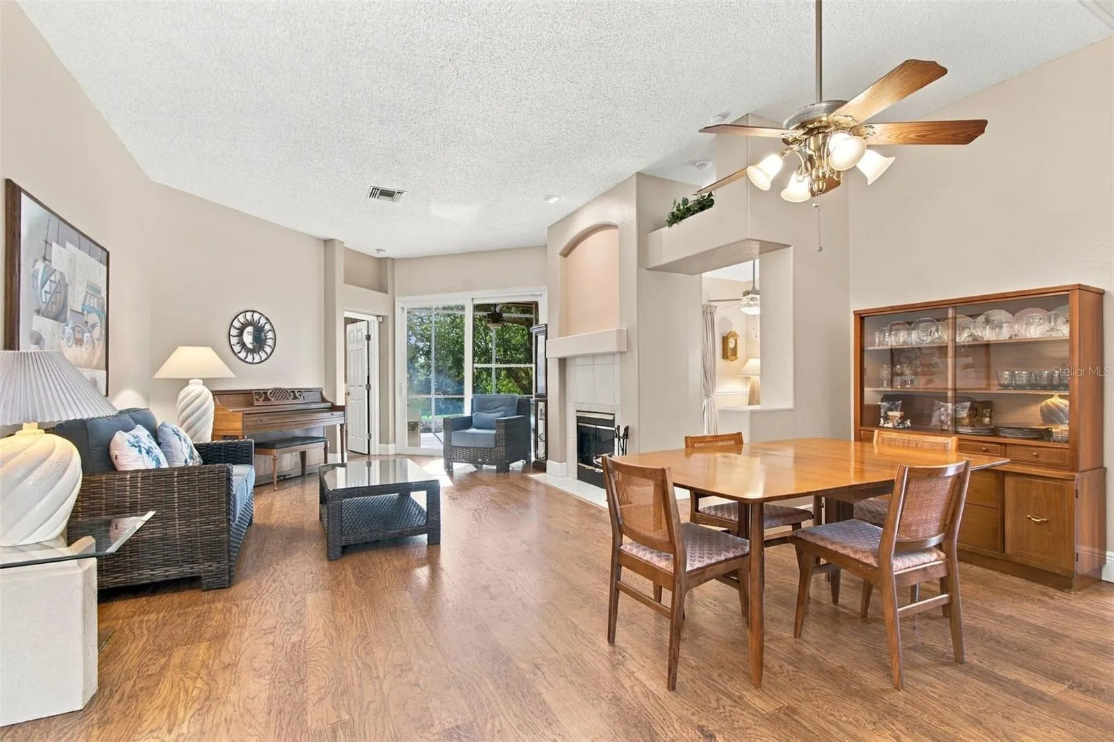 Greeted by a spacious open living area with wood burning FP, sliders to lanai