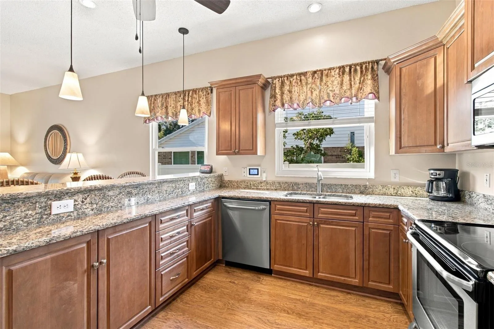 Kitchen open to Family Room with LVP, granite, breakfast bar