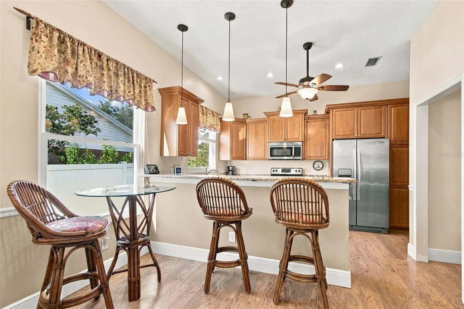 Kitchen w/ breakfast bar is open to Family Room