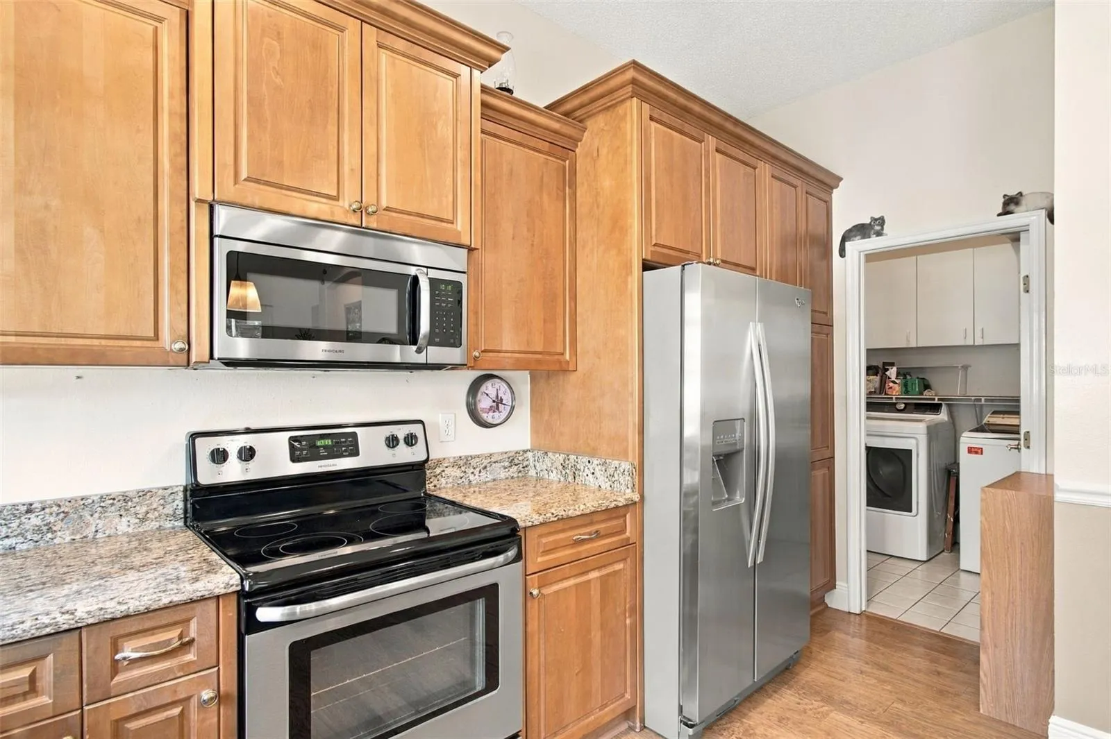 Kitchen to Laundry Room & Garage entry.  Lots of cabinet storage