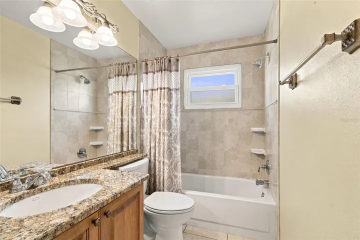 Bathroom 2 is updated with granite, new shower tile