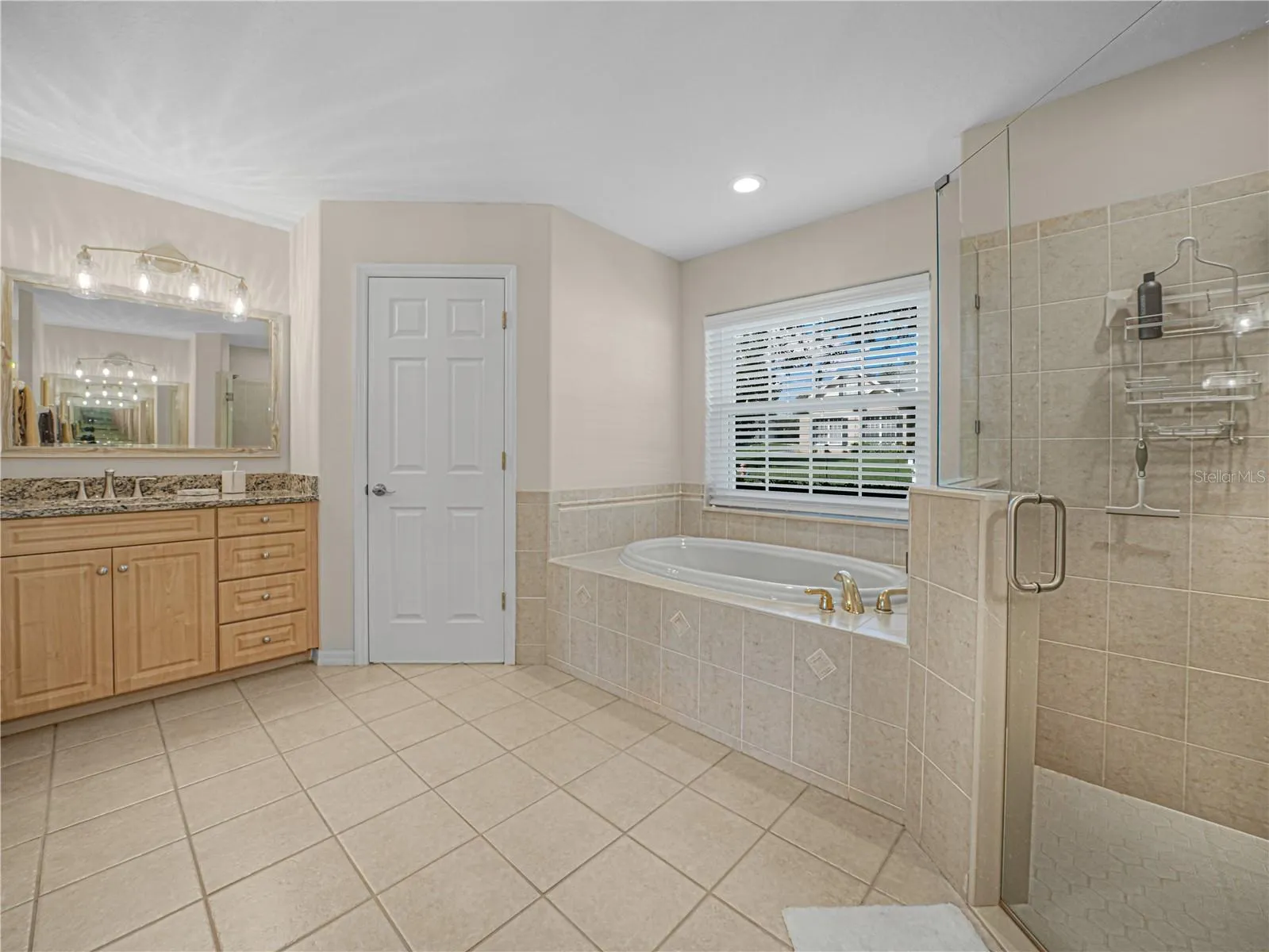 Primary Bathroom has walk in shower and oversized garden tub