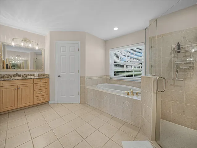 Primary Bathroom has walk in shower and oversized garden tub
