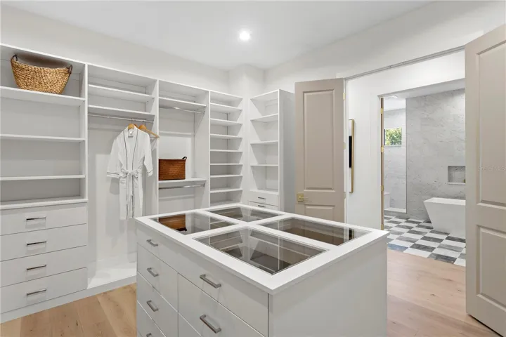 Primary walk in closet with center island