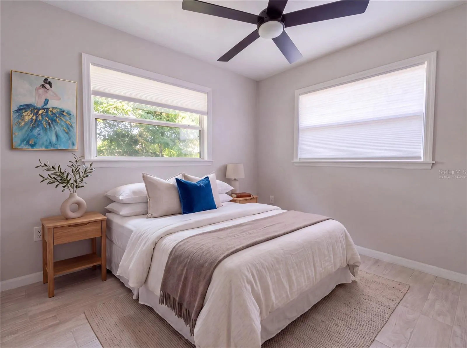 Bedroom 1. All new flooring—porcelain tile.Virtually Staged
