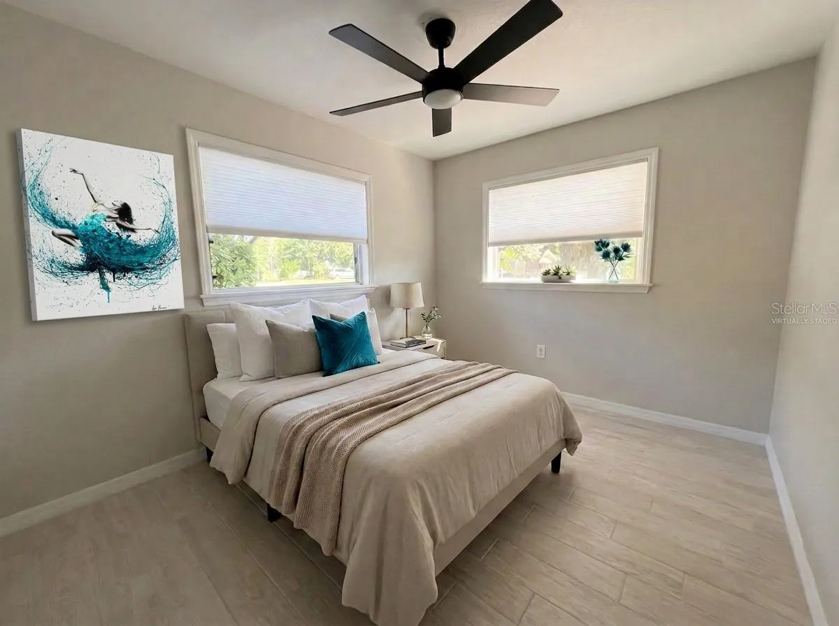 Bedroom 2. All new flooring—porcelain tile.Virtually Staged