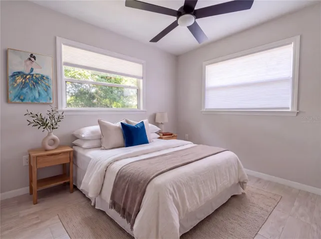 Bedroom 1. All new flooring—porcelain tile.Virtually Staged