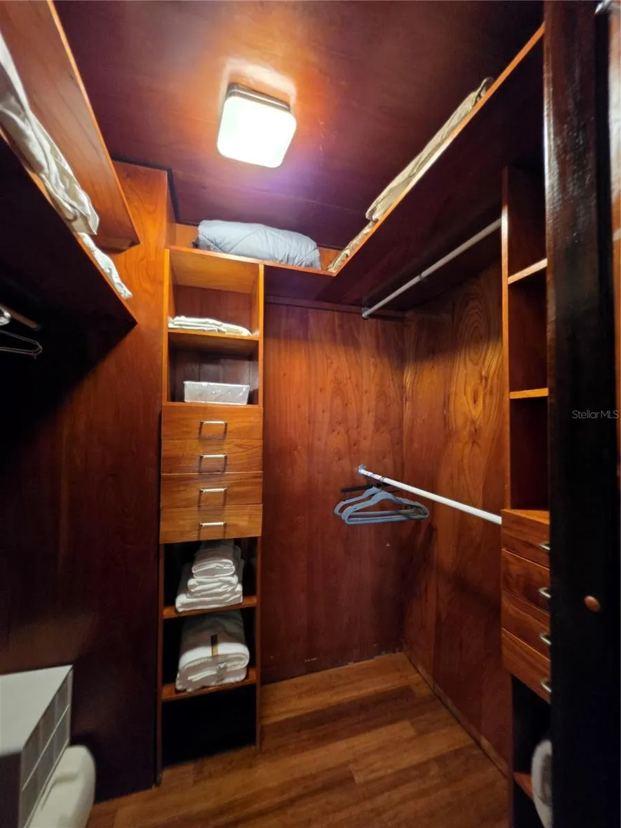Primary bedroom walk-in closet
