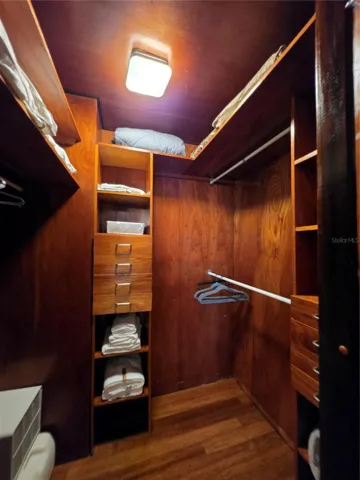 Primary bedroom walk-in closet