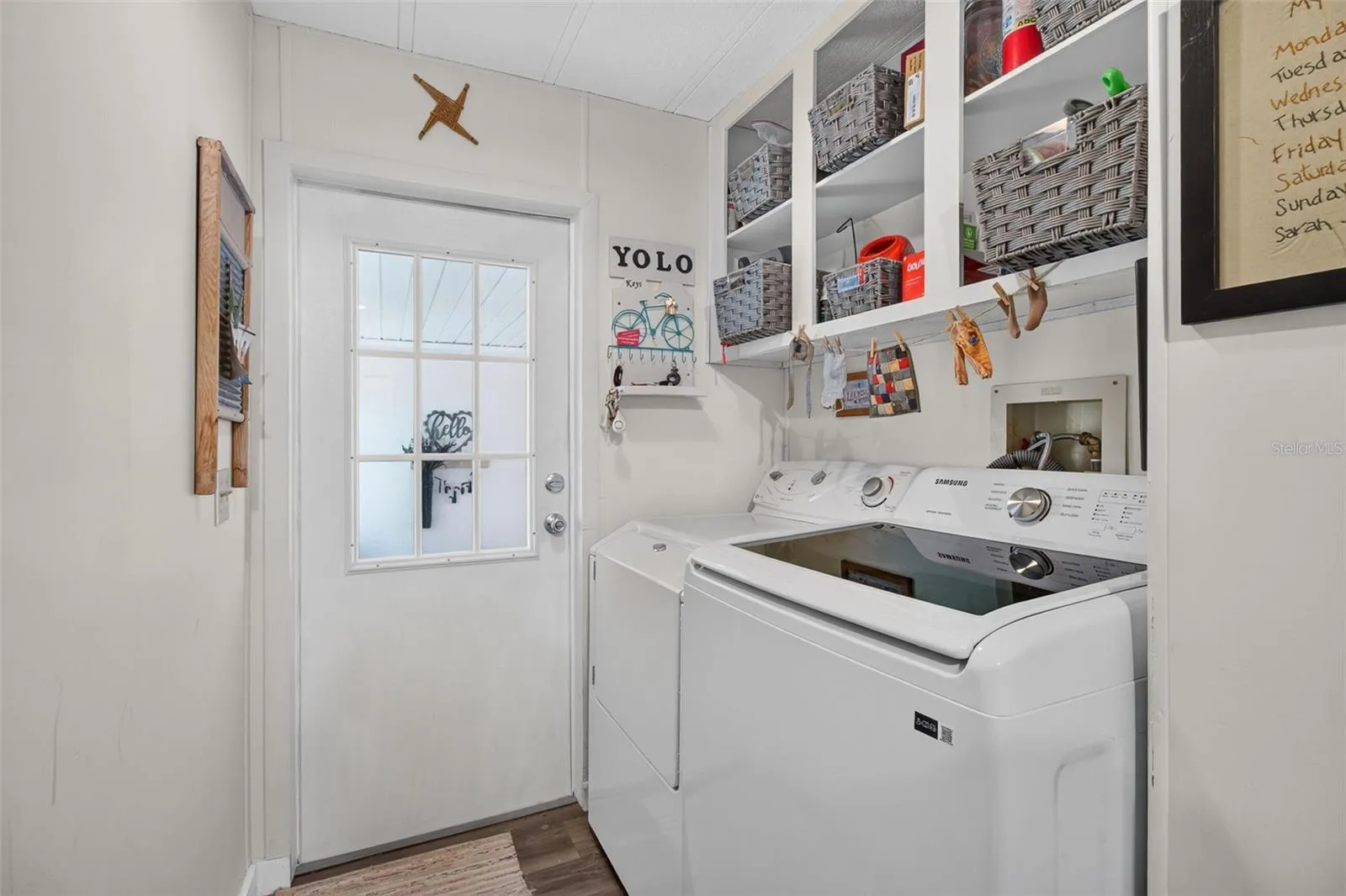 Interior laundry with door to front room, entry.