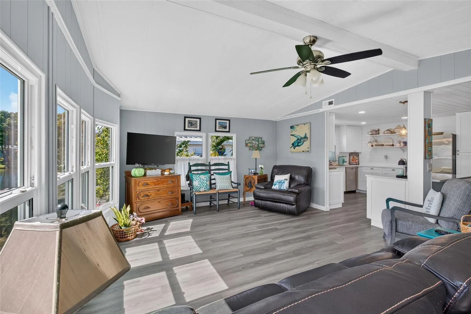 Open floor plan living room, kitchen, dining.