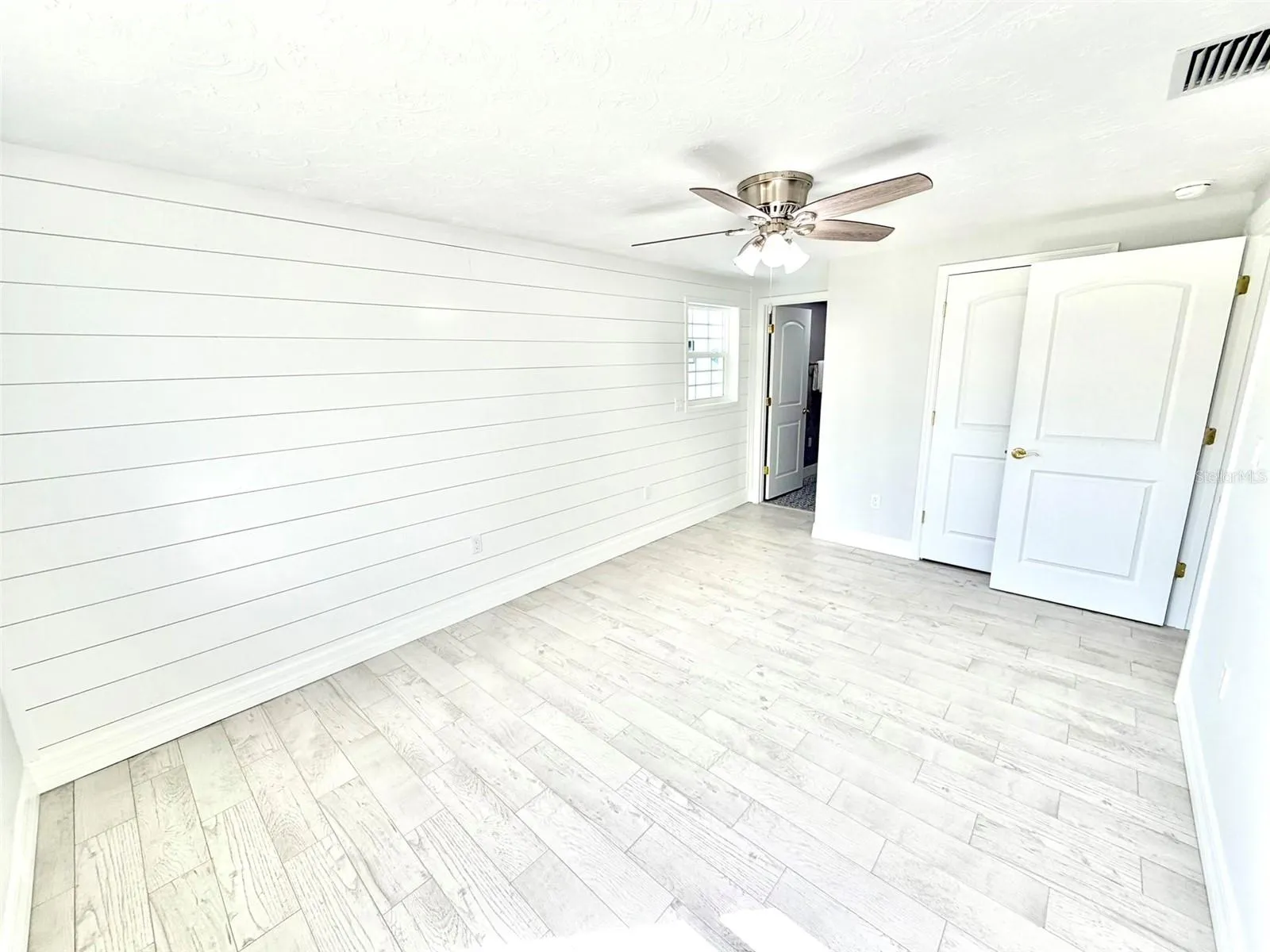 Primary Bedroom with Shiplap Wall