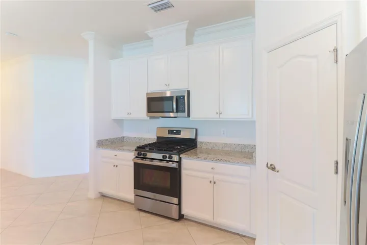 Pantry and stove with microwave above