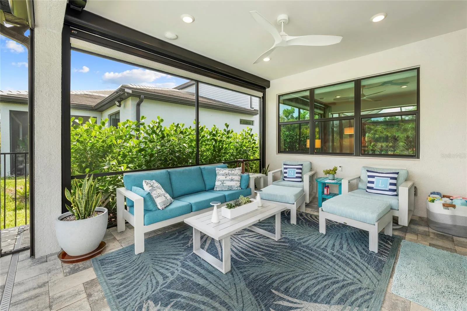 Patio is complete with Hurricane screen enclosure to store all your patio furniture!