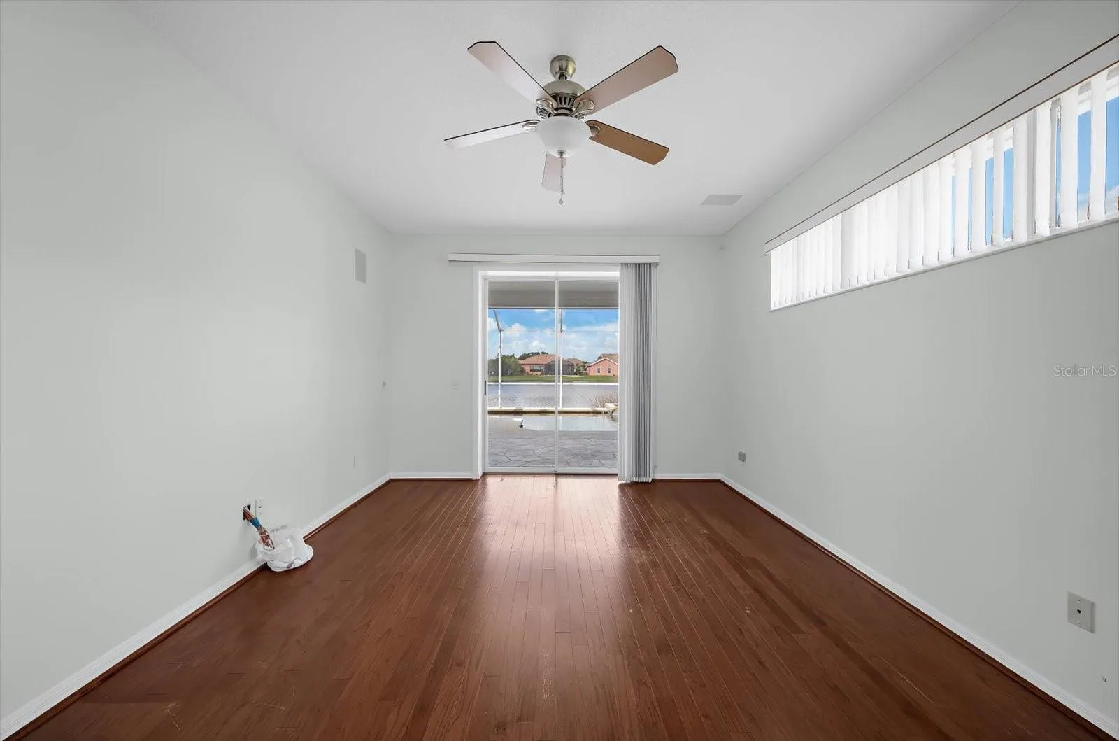 Primary bedroom with sliding glass doors to the pool