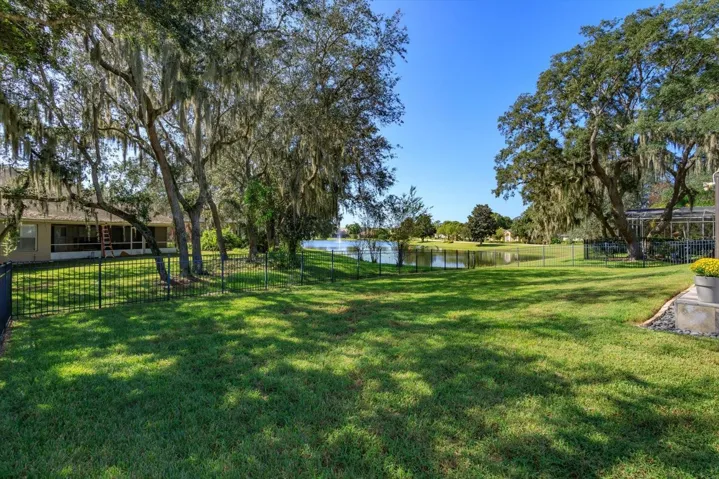 Large .34 acre lot overlooking pond with fountain