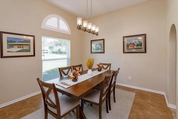 Freshly painted formal dining room with new fixture and new window