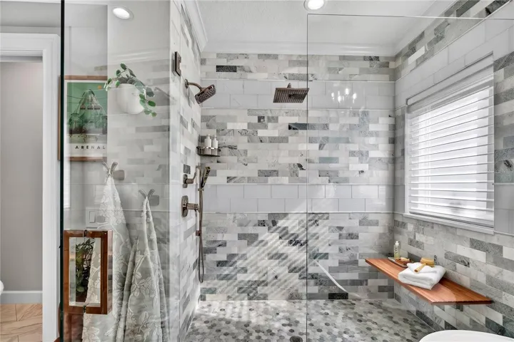 Tranquil Marble Shower with Multiple Heads and Rainfall Feature