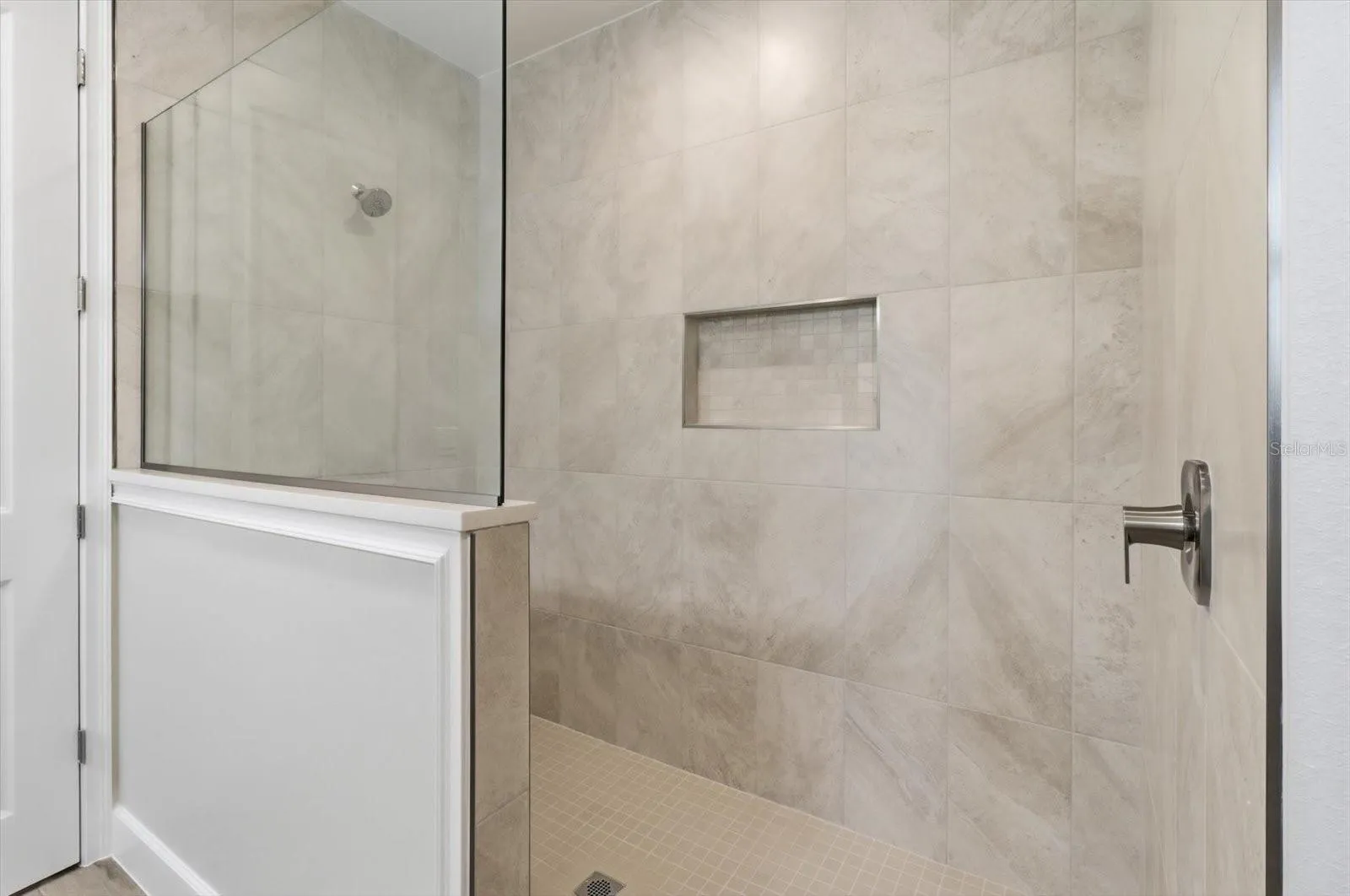 The primary bathroom also has an oversized tiled shower.