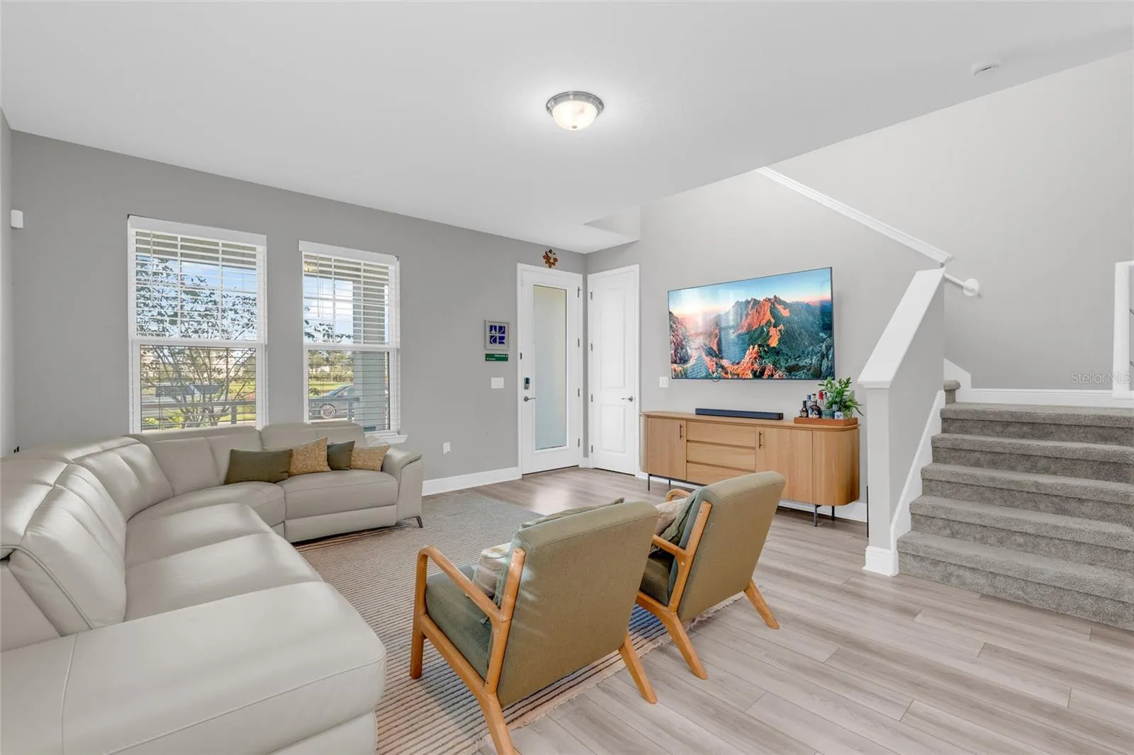Open living area with staircase to the second floor