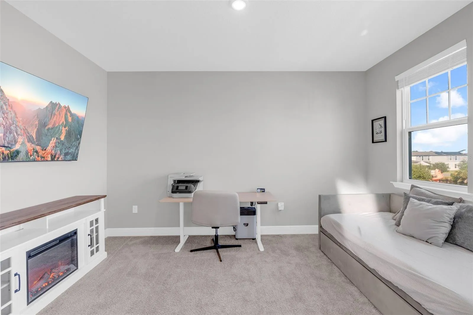 Upstairs flex room with natural light and space to relax