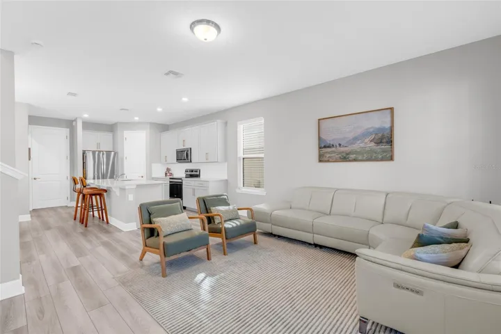 Living room with an open layout and natural light