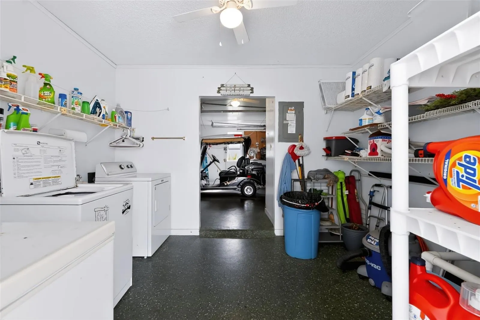 Laundry and storage connected to golf cart garage
