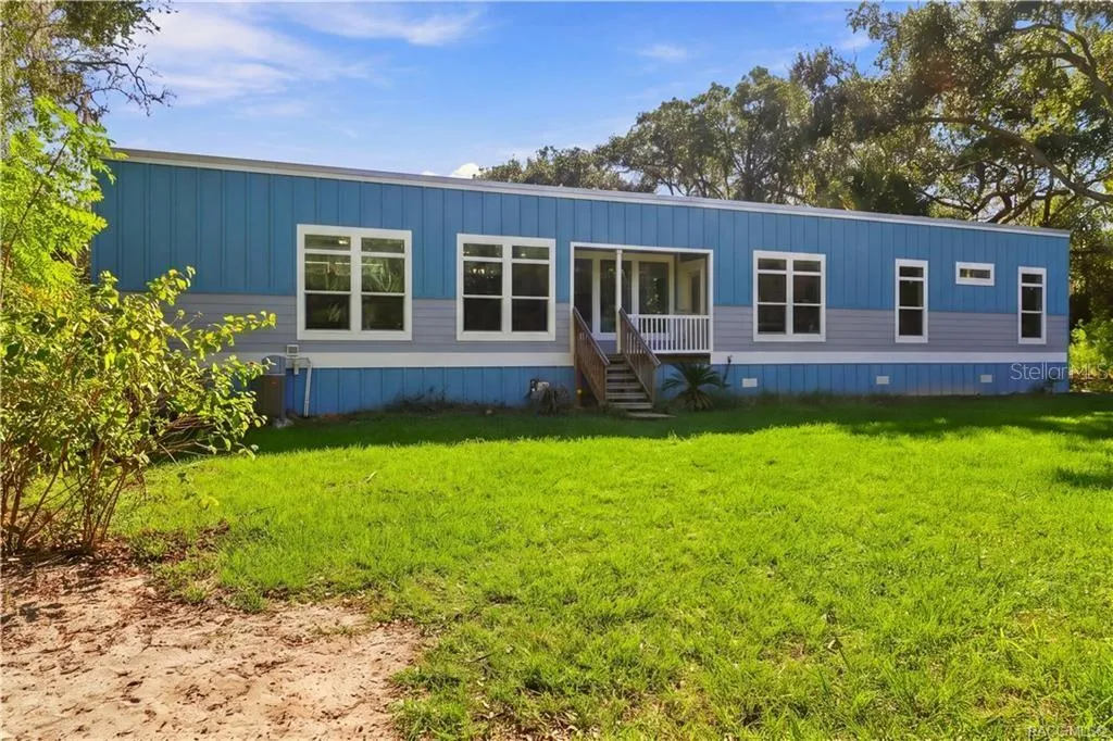 SPACE TO ENJOY THE OUTDOORS! The spacious lawn, mature shade trees &amp; inviting covered front porch create a wonderful setting for enjoying the peaceful surroundings.