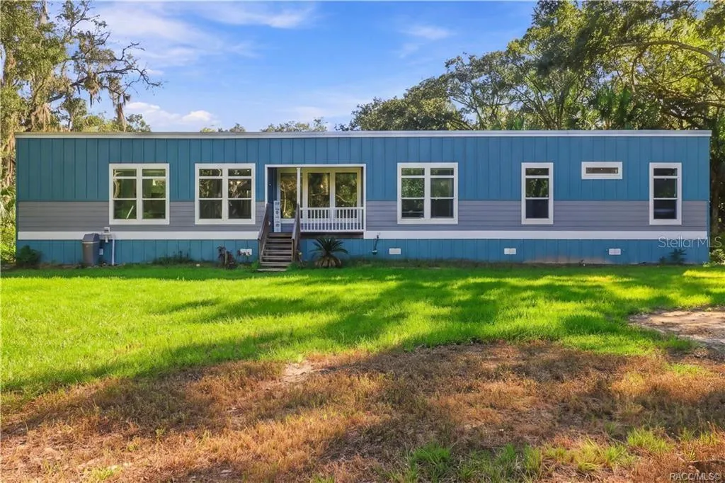 WELCOME HOME TO THE PICTURE-PERFECT COUNTRY SETTING! Attractive blue exterior, crisp white accents &amp; generous green space give this 2024 home a fresh, welcoming appearance.